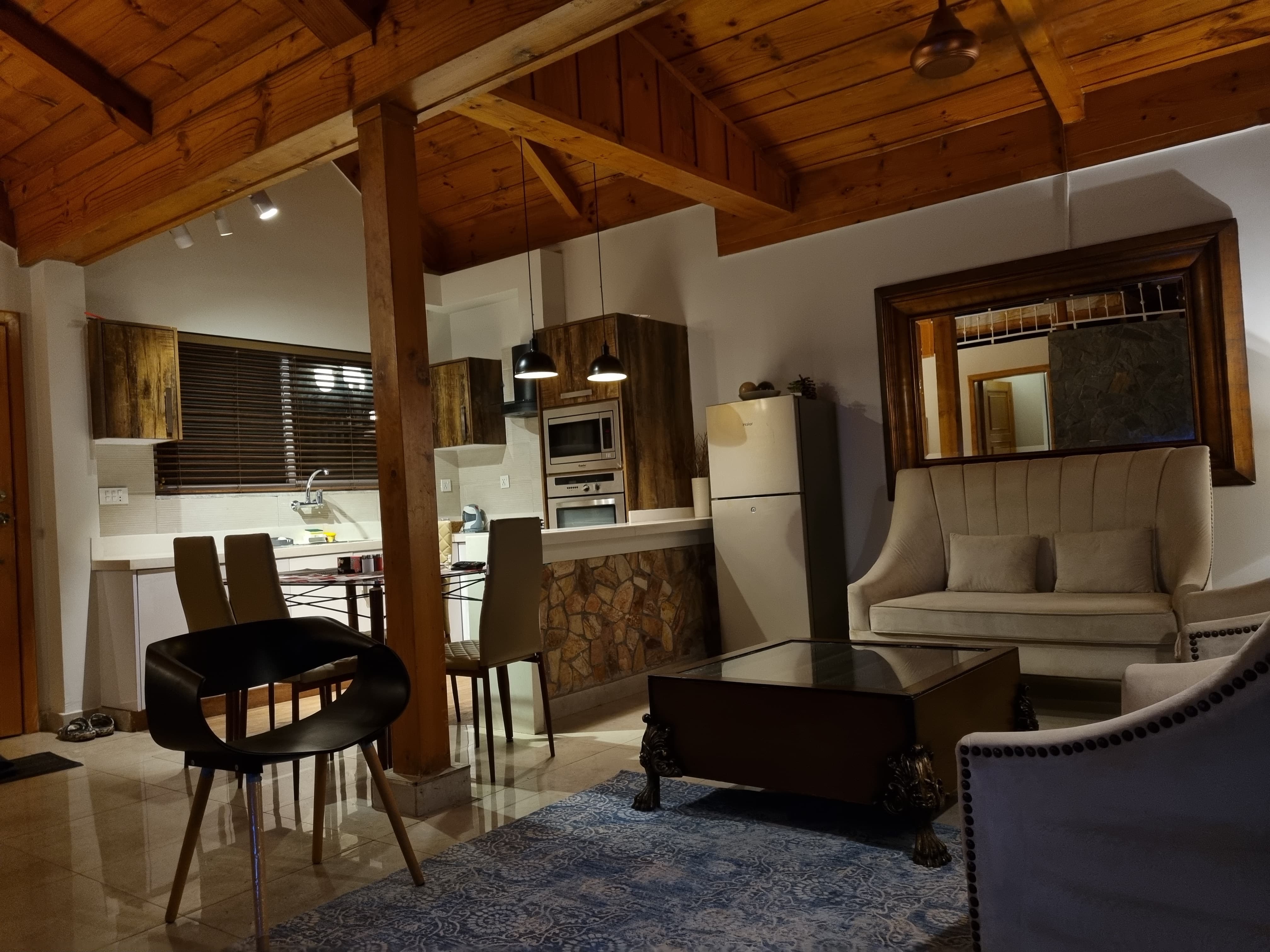 happy family with children enjoying cottage stay, warm cozy interior, smiling faces, vacation atmosphere